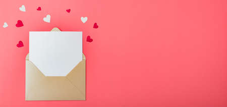 Love letter. Gold envelope on a red background with hearts. Place for your text.