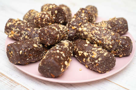 A cake made from grated biscuit cookies, cocoa and sugar. A quick dessert. Potato cake.の写真素材