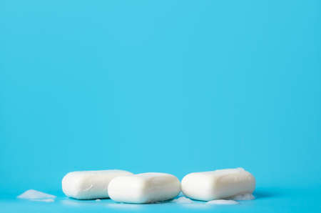 Global Handwashing Day. Hygiene concept, background. Several bars of white soap lie on a blue background.の写真素材