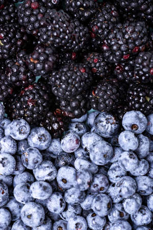 blueberries and blackberries close-up. Fruit, berry background.の写真素材