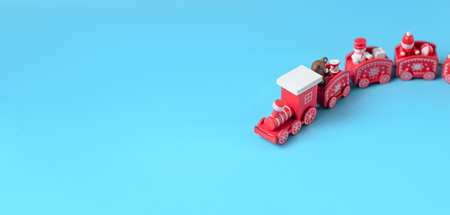 New Year's red train on a blue background. New Year, Christmas concept. Place for your text.の写真素材