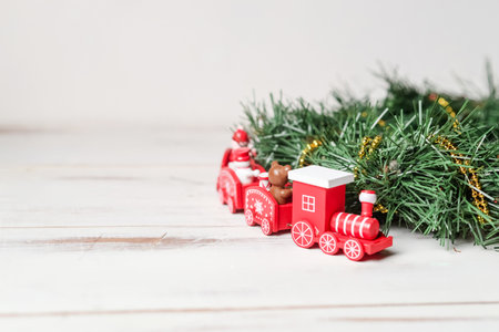 The concept of the coming new year, christmas. New Year's red train with a green branch on a white background.の写真素材