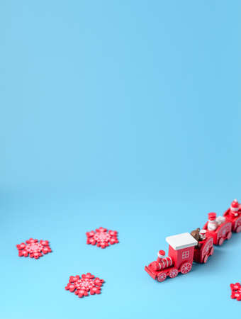 New Year's red train on a blue background. New Year, Christmas concept. Place for your text.の写真素材