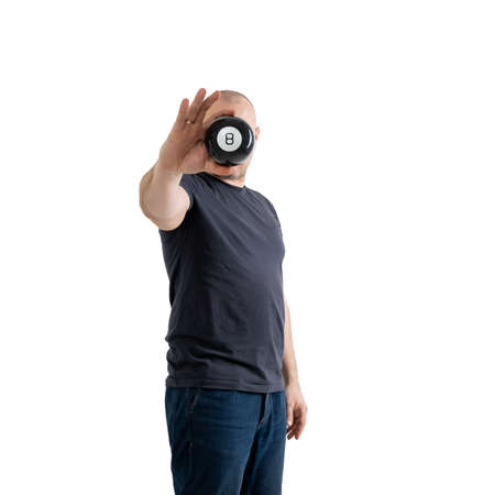 Predictions billiard ball in the hands of a man. Isolated on a white background.の写真素材