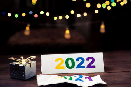 2022 numbers and New Year's gift on the background of New Year's lights garlands.の写真素材
