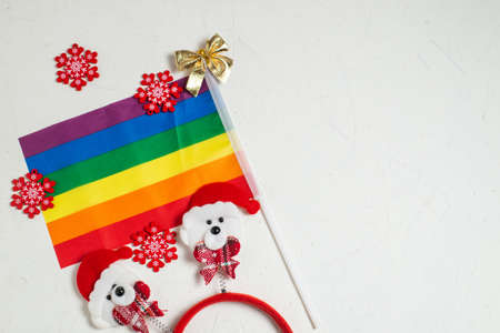 LGBT and New Years concept. Rainbow flag and New Year's decor on a white background. Place for your text.の写真素材