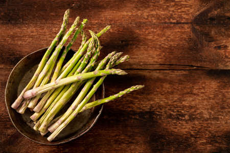Raw asparagus. wooden background. Place for text. view from above.の写真素材