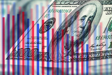economic crisis. The US dollar against the backdrop of a declining chart. Inflation, depreciation of currencies concept. Decrease in profit.の写真素材