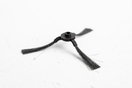 Brush detail for a robot vacuum cleaner on a white background.