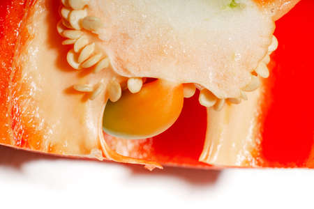 Red sweet pepper super macro. view inside. Bell pepper seeds close-up.