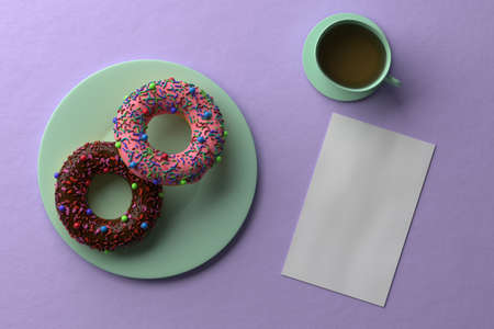 Two donuts and a cup of tea. purple background. blank sheet of paper. breakfast concept. 3D renderingの写真素材