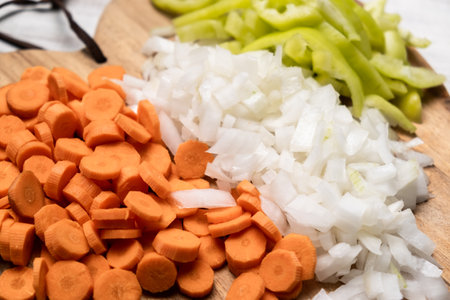 Chopped fresh peppers, onions, carrots. Vegetarianism concept. Mix of vegetables.