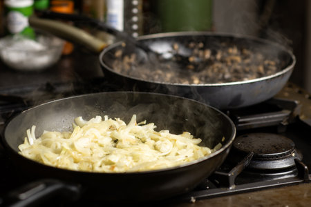Roasting onions. Chopped onions are fried in a pan. cooking food.の写真素材