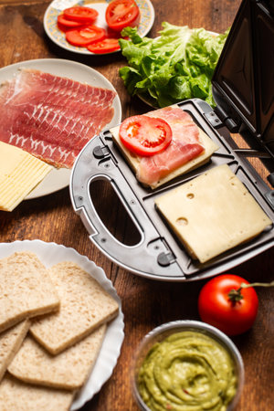 sandwich maker. Cooking sandwiches with different fillings.の写真素材