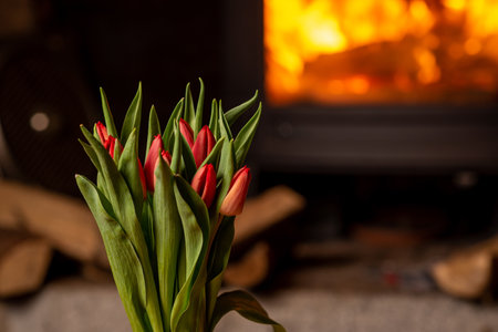 Bouquet of tulips on the background of the fireplace. Bouquet of flowers.の写真素材