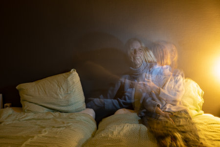 Woman on the bed with a long exposure.の写真素材