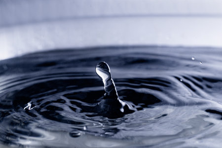 The surface of the water on which a drop of water falls close-up. abstract background. water concept.の写真素材