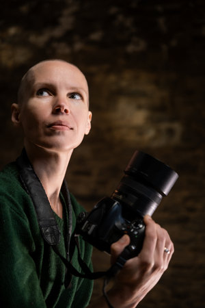 An enthusiast of photography, a woman in her prime, holding a camera and capturing smiles with a...