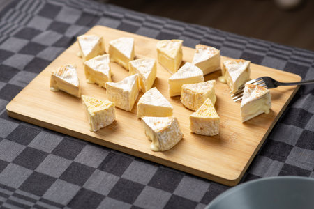 French cheeses, Camembert cheese, Brie on a wooden cutting boardの写真素材