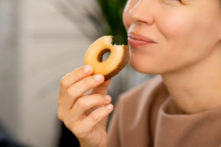 Indulging in temptation: A middle-aged beauty succumbing to the allure of a chocolate-drenched donut
