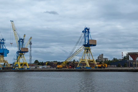 Scrapyard Symphony: The industrial port showcases a symphony of steel scrap, featuring a towering...
