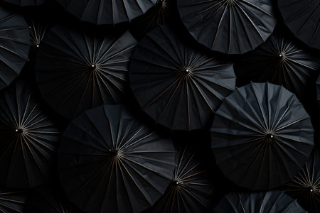 Top view background of open black umbrellas - a stylish and uniform compositionの素材