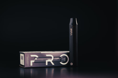 Caen, France - March 18, 2024: Electronic cigarette Vuse on a black background.のeditorial素材