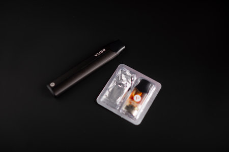 Caen, France - March 18, 2024: Electronic cigarette Vuse on a black background.のeditorial素材
