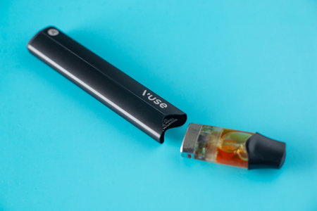 Caen, France - March 18, 2024: Electronic cigarette Vuse on a blue background.