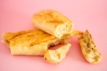 A close up of a piece of bread with a few other pieces of bread on top of it. Concept of simplicity and comfortの写真素材