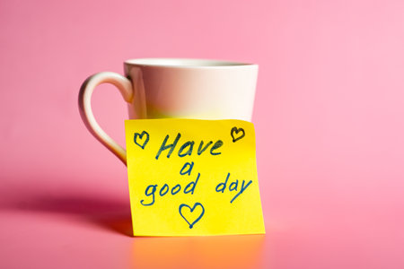Motivational message on coffee mug with pink background.の写真素材