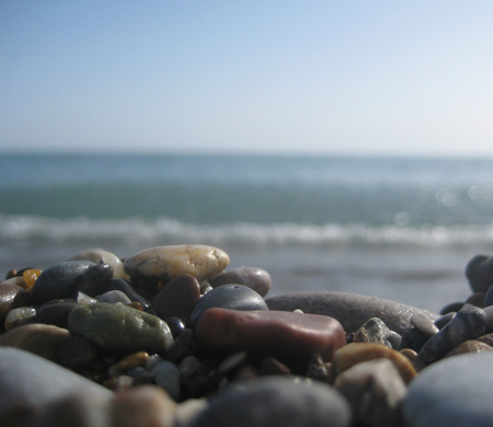 sea color stones against the seaの写真素材