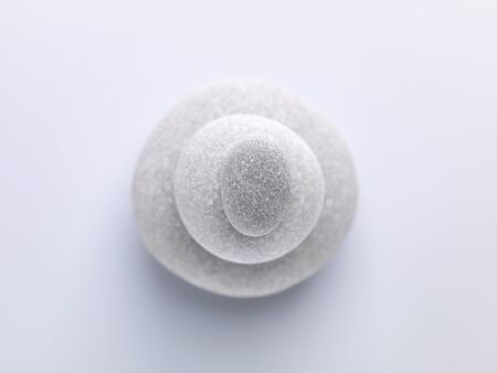 Three pebbles be stacked up on top of each other with selective focusの写真素材
