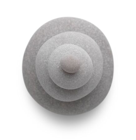 Four pebbles be stacked up on top of each other with selective focus の写真素材