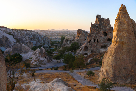 Ancient times people carved out homes in the fairy chimney rock formations in Cappadocia, Turkey. For it's unique geological formations, it's an popular travel destination in Turkey.の写真素材