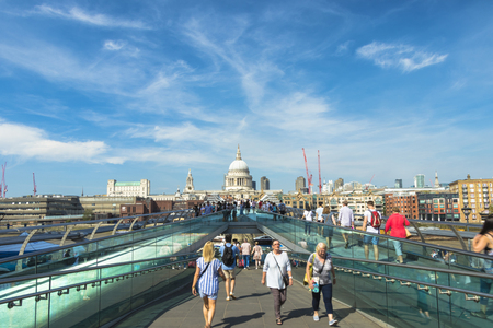 London, United Kingdom - August 28, 2017: People walking on the famous Millennium Bridge and St Paul's cathedral in the background.のeditorial素材