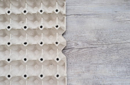 emtry egg box from recycle paper packaging carton egg on wooden background. minimal concept.