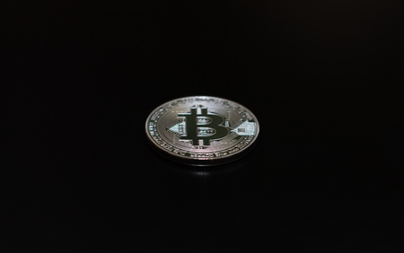 Bitcoin on a black background. Metal coin, crypto currency.の写真素材