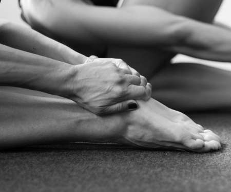 Series of monochromatic black and white photographs taken in a yoga studio. These images explore the yogic grips common in a yoga class.の写真素材