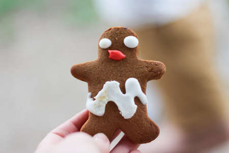 Funny looking gingerbread man with smudged icingの写真素材