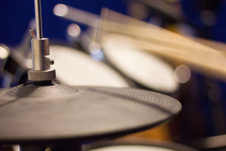 Action shot of a drummer practicing drums using rubber cymbalsの写真素材