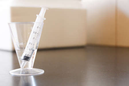 Plastic measuring cup and syringe equipment for cheese makingの写真素材