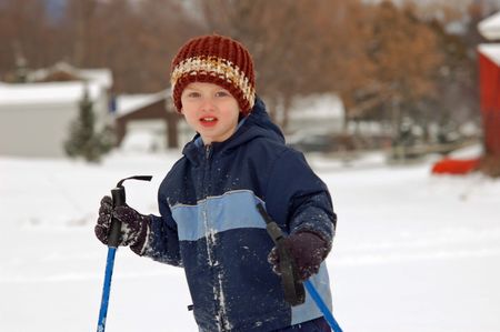 Boy with ski polesの写真素材