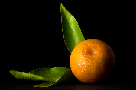 Clementine on black backgroundの写真素材