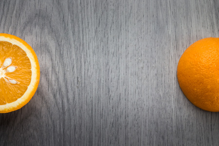 Orange on grey woodの写真素材
