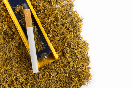 Cigarette rolling machine and empty cigarette tube and tobacco on white backgroundの写真素材