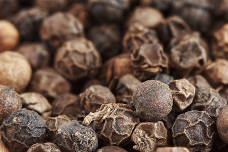 Pile of black pepper corns. Close-up with selective focusの写真素材