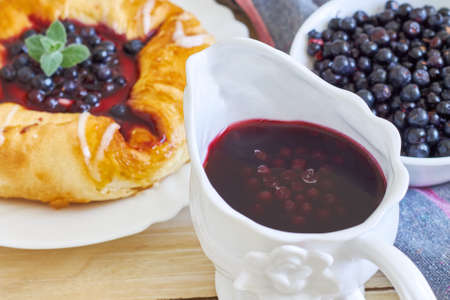 Blueberry compote with puff pastry pie in backgroundの写真素材