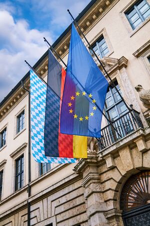 European Union, German and Bavarian flag on a buildingの写真素材