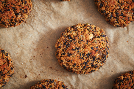 Vegan quinoa and bean burgers made with beans, quinoa, nori algae, oats, smoked peppers and onionsの写真素材